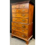 A George III style mahogany chest on chest, dentil cornice, top section with pair of short above