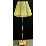 A mid 20th century green onyx and gilt metal standard lamp with shade, approx 155cm high overall