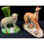 A 19th century Staffordshire figure, standing Greyhound, 11cm high; sheep spill vase (2)