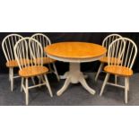A modern country kitchen style extending pedestal dining table, and set of five spindle-back