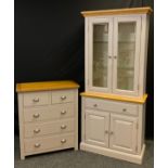 A contemporary chest of two short over three long drawers, painted grey, rounded rectangular oak