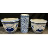 A pair of 20th century reproduction Chinese blue and white planters, flowering water lily