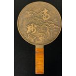 A Japanese bronze Geisha hand mirror, cast with Cranes and blossoming branches, character script,