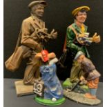 A cast iron painted doorstop, Golfer, 36cm high; another 39cm high; others golf bag (4)