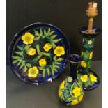 A Moorcroft candlestick table lamp, tube lined in the Buttercup design, 28cm high overall,
