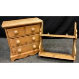 A Victorian pine miniature chest of drawers (table-top chest), two short over pair of long