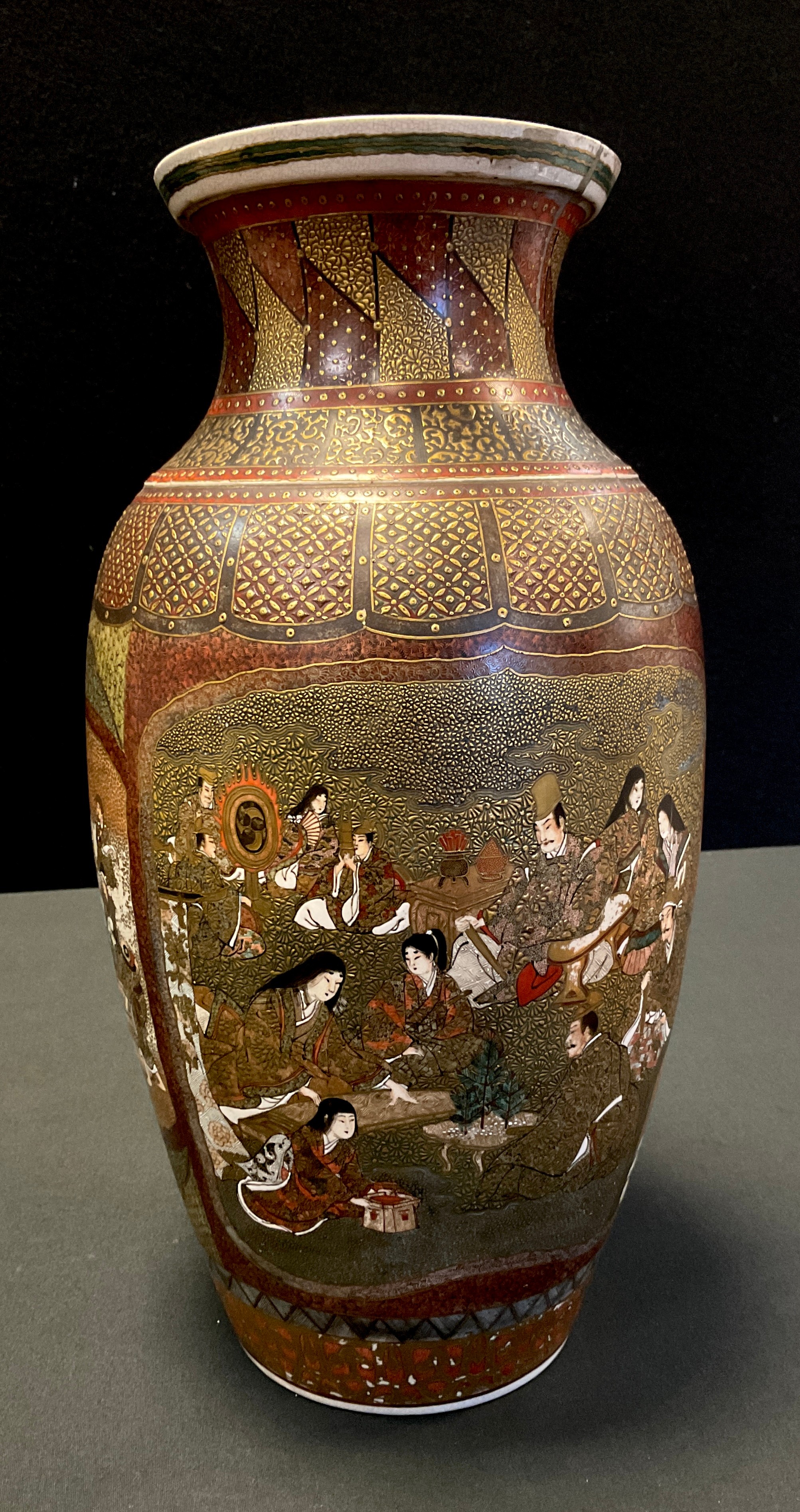 A Japanese Satsuma pottery Meiji vase, intricately decorated with traditional figure panels,