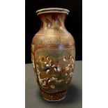 A Japanese Satsuma pottery Meiji vase, intricately decorated with traditional figure panels,