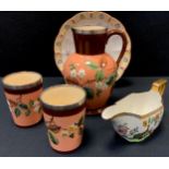 A Victorian silver mounted stoneware jug and beakers set, painted with flowers, silver collars,