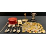 Five silver teaspoons; twin handled trophy; international coins and tokens, some marked Friedrich