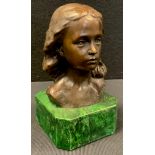 A Bronzed metal bust of girl , green and black stone base, 16cm tall