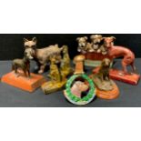 A Cast iron doorstop three bull dog Puppies, pair of Alsatian bookends etc (8)