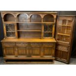 An Old Charm oak dresser, ‘Sovereign’ model, leaded glass cupboard doors to top, with two tiers of