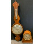 A 19th century rosewood wheel barometer/thermometer, silvered scales, 102cm long; oak cased mantel