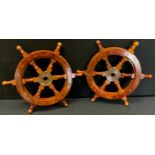 A pair of reproduction wooden ship wheels, 30cm(2)