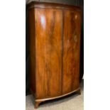 A Victorian mahogany bow-front wardrobe, moulded pediment, pair of doors, bracket feet, 189.5cm high