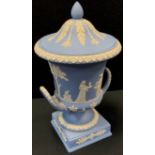 A Wedgwood powder blue Jasperware twin handled urn & cover, 29cm high, impressed marks