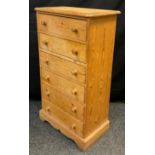 A mid 20th century pine wellington chest, six short drawers, 106cm high x 60cm wide x 34.5cm deep.