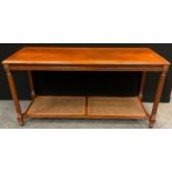 A 20th century reproduction mahogany console table, reeded legs, Bergere weave under-tier, 68cm