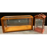 A contemporary table-top collector’s display cabinet / Vitrine, arched and glazed pediment top,