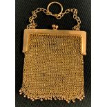 A yellow metal chain mesh evening bag/purse, ball fringe, 10cm x 8.2cm, with suspension chains,