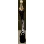 Advertising - an unusual tall twisted elongated Coke a Cola Bottle sculpture, 710ml (sealed with
