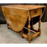 A late 19th century oak gate-leg dining table, 75cm high x 123cm x 52.5cm (172.5cm with leaves