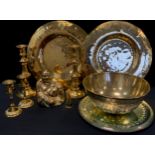 A Chinese brass bowl; two pairs of brass candlesticks; plaques etc; mirrored cake platter etc