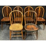 A pair of 19th century elm spindle-back chairs, 85.5cm high (42.5cm to seat); a set of four late