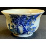 A modern blue and white Chinese tea bowl, decorated with wildlife, 9.5cm wide