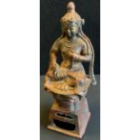 A modern Chinese bronzed figure Buddha in the lotus position, on pierced plinth, after the