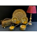 Metalware - graduated brass pans; facet brass table lamp, plaques, etc, lamp 73cm high; etc