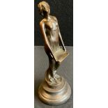 A Bronzed art deco style figure of a semi nude lady singing mounted a stone plinth, 19cm high