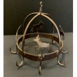 A wrought and cut iron game/meat hanger, eight point crown with Deer panels, 43cm diameter.