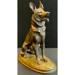 A bronzed spelter model as a seated German Shepherd dog, indistinctly signed, 28.5cm high