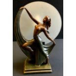 An Art Deco style bronze coloured table lamp, as a dancing girl, frosted screen shade, 37.5cm high