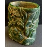 A modern Chinese carved green brush pot, possibly jade, impressed mark, 16cm high, 14cm wide