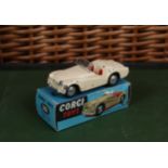 Corgi Toys 301 Triumph TR2 Sports car, cream body, clear plastic windscreen intact, spun hubs, boxed