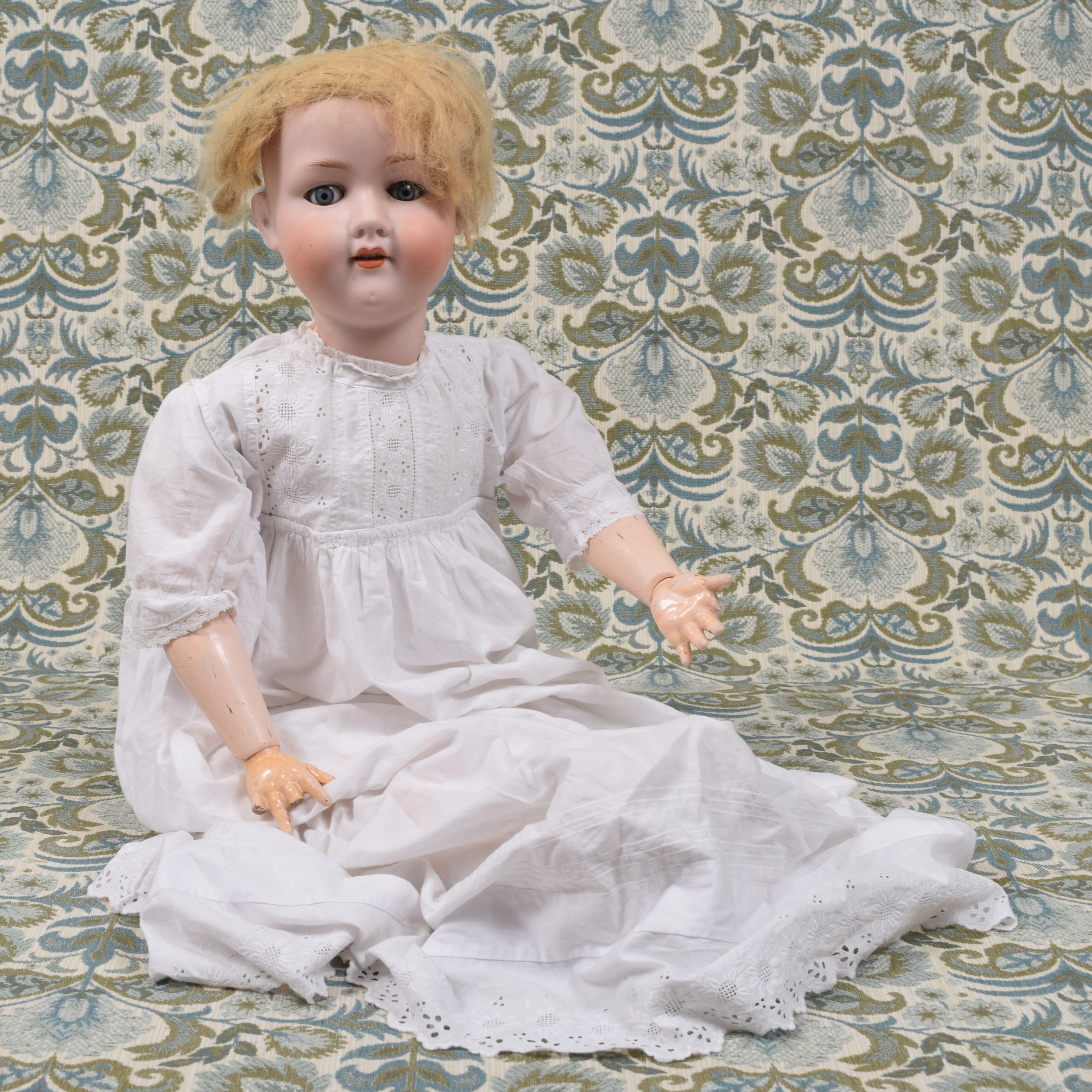 An Armand & Marseille (Germany) bisque head and painted ball jointed composition bodied doll, the