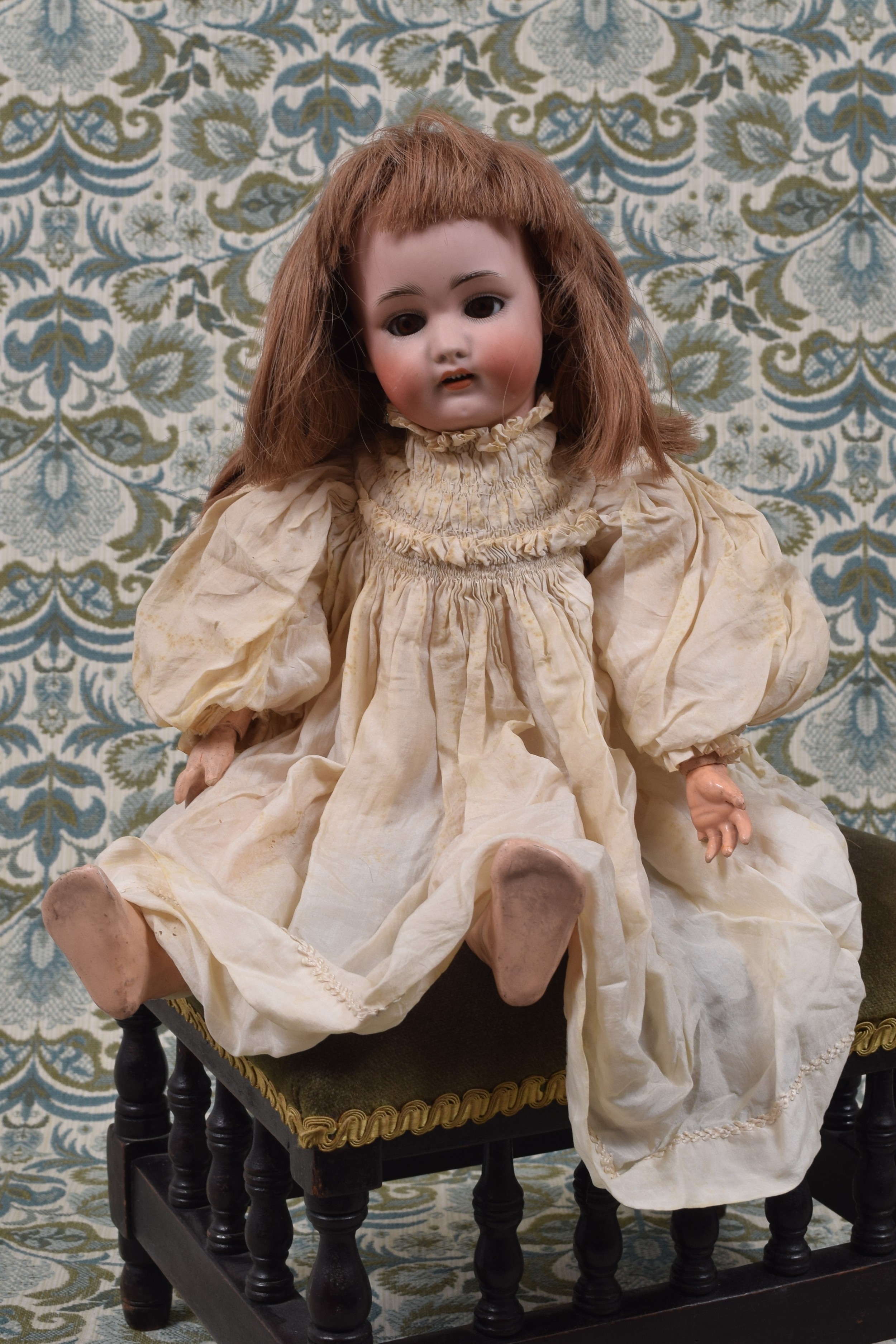 A Simon & Halbig (Germany) bisque head and painted ball jointed composition bodied doll, the