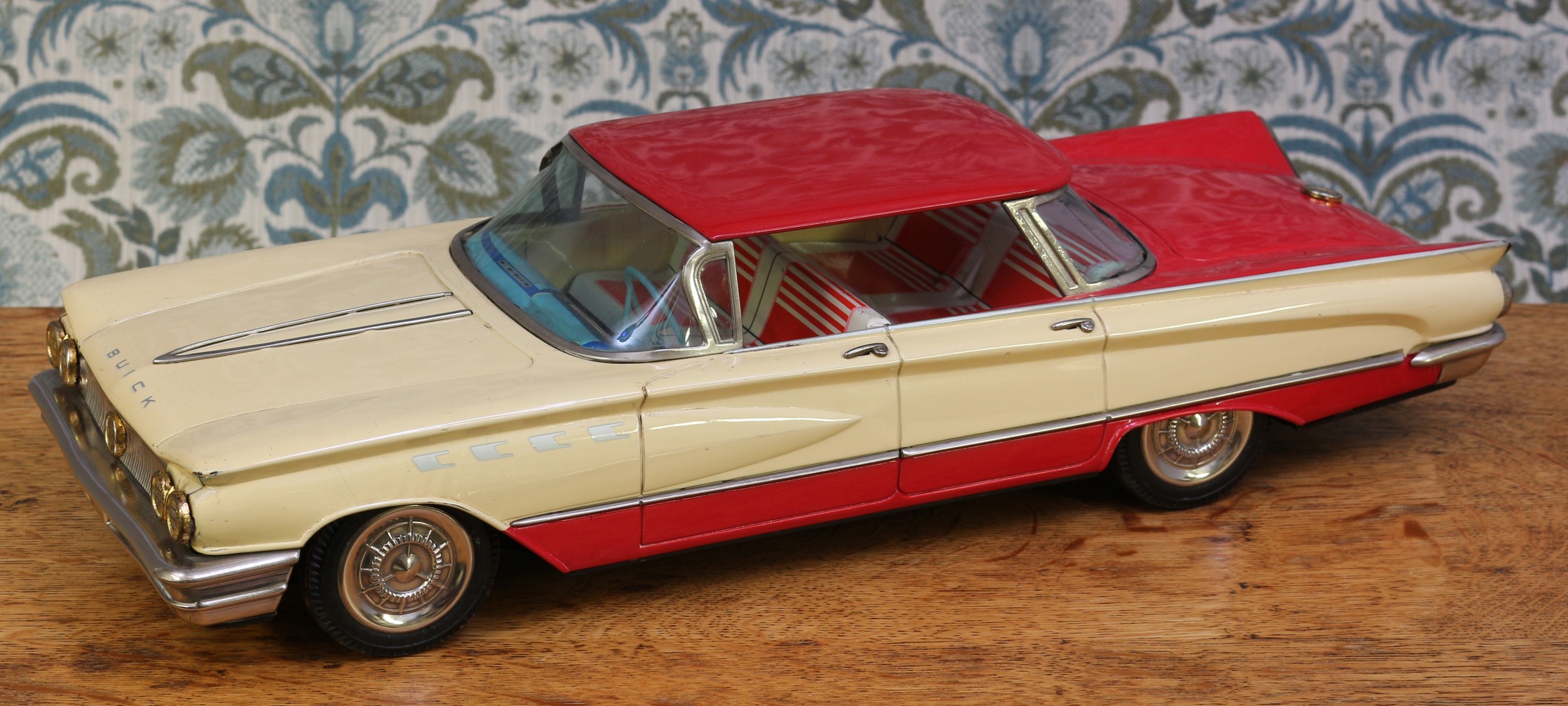 A 1960's Ichiko (Japan) tinplate and friction powered Buick, two tone red and cream body with - Image 2 of 3
