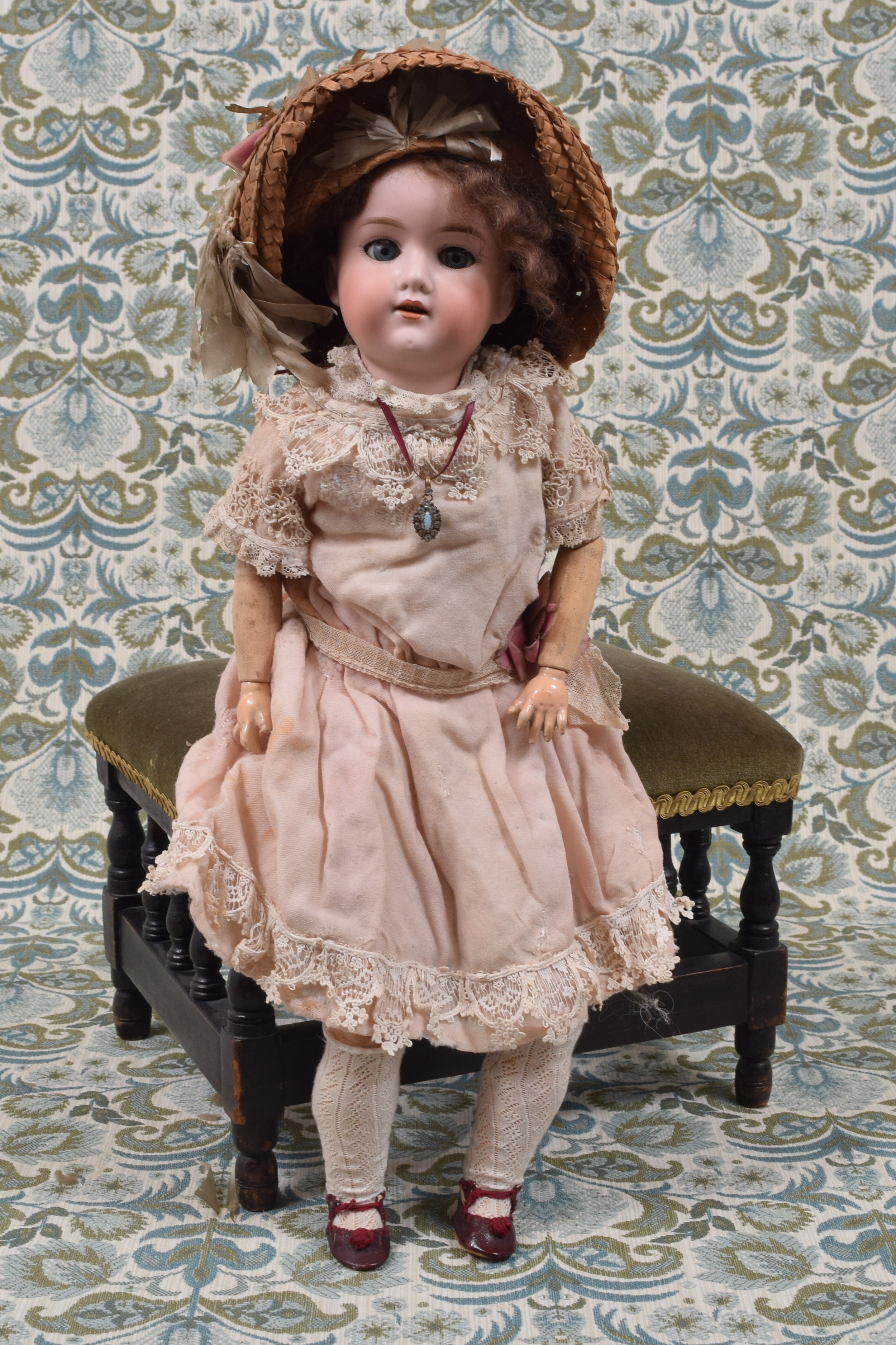 An Armand & Marseille (Germany) bisque head and fixed ball jointed composition bodied doll, the