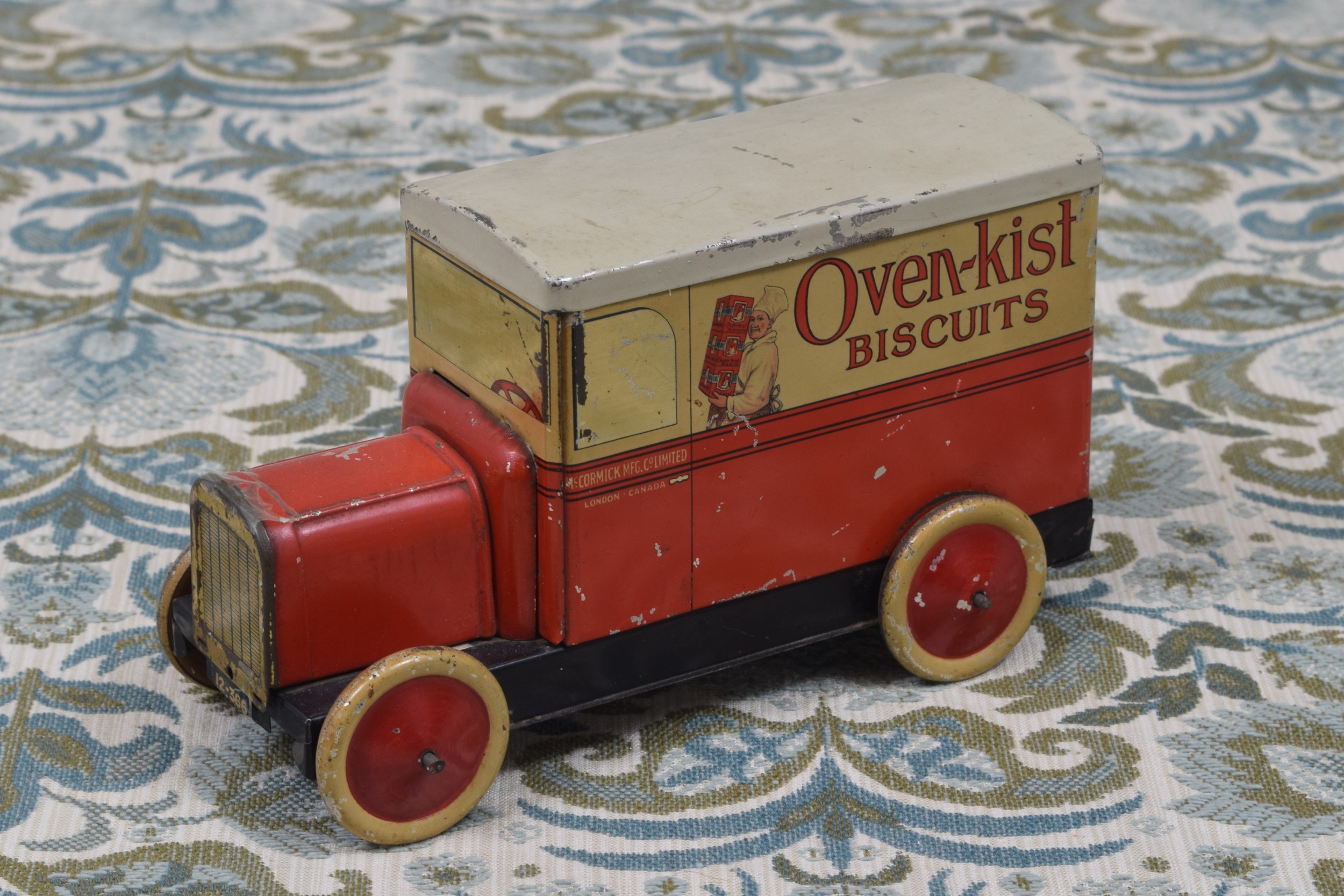 Advertising - a McCormick novelty tinplate biscuit tin in the form of a delivery van, manufactured