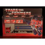 A Hasbro Transformers Autobot Commander Optimus Prime set, comprising snap-on weapons and