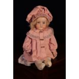 An Armand & Marseille (Germany) bisque shoulder head doll, the bisque head inset with fixed blue