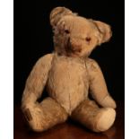 A 1930's Merrythought golden mohair jointed teddy bear, amber and black glass eyes, pronounced snout