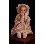 An Armand & Marseille (Germany) bisque shoulder head doll, the bisque head with weighted sleeping