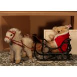 Steiff (Germany) EAN 670879 Father Christmas teddy bear with Pony sledge, each with trademark '