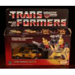 A Hasbro Transformers Autobot Warrior Sunstreaker, comprising snap-on weapons and accessories,