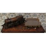 A scratchbuilt and well-engineered live steam 2-6-0 tank locomotive and six wheel tender, the